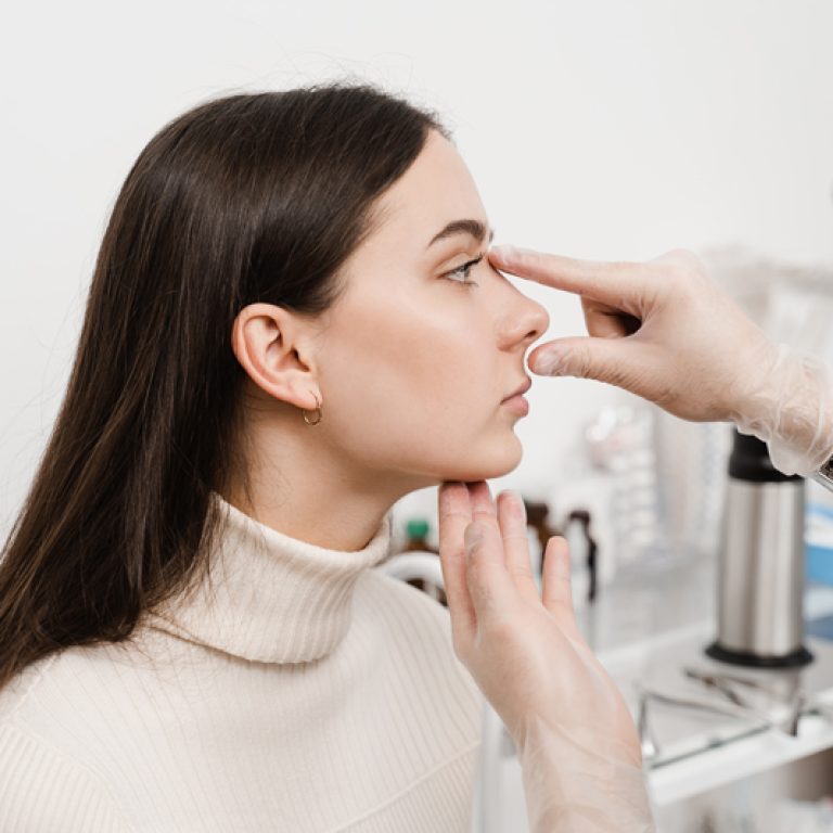 septoplasty-is-surgery-correct-deviated-septum-rhinoplasty-is-reshaping-nose-surgery-change-appearance-nose-improve-breathing-surgeon-is-touching-examining-girl-nose